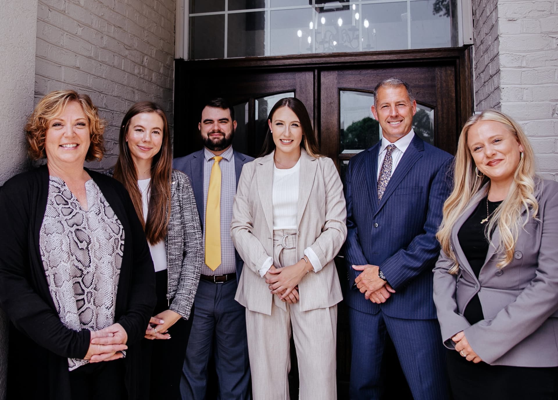 The Seeley Law Firm team standing in front of the office.